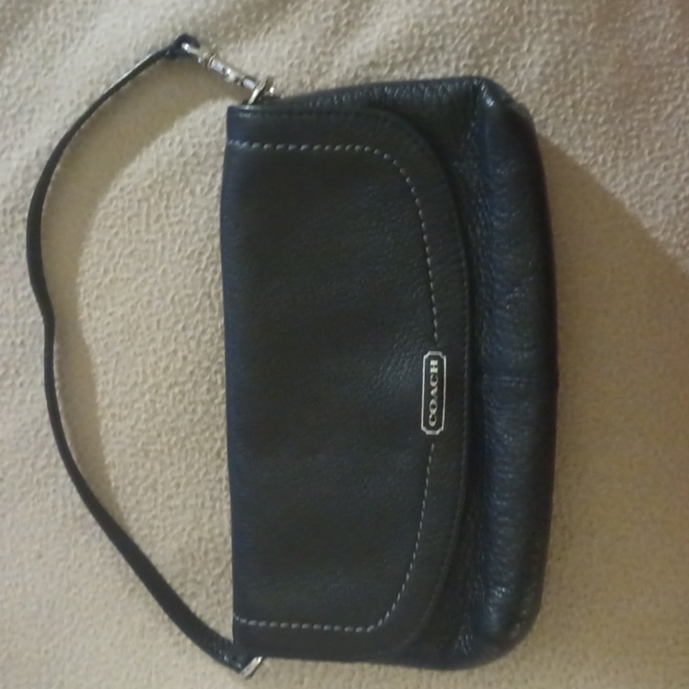 Black mini wristlet Leather with a metalic teal interior Coach purse